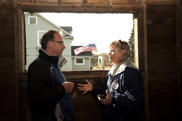 David Myers (left), Director of the DHS Center for Faith-based and Neighborhood Partnerships, and FEMA Region VIII Administrator Robin Finegan, at a flood-damaged home.