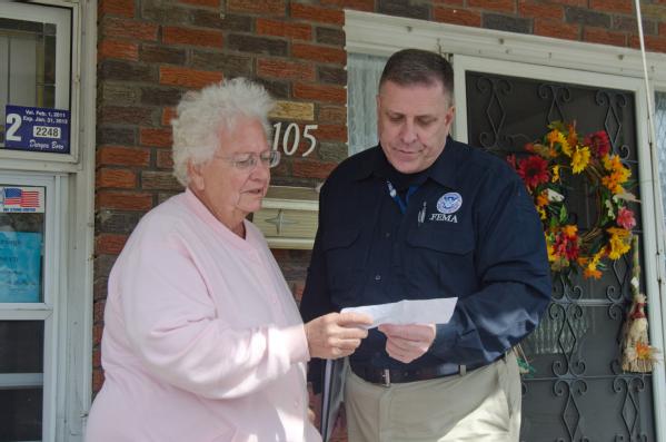 FEMA Federal Coordinating Officer Thomas J. McCool speaks with resident