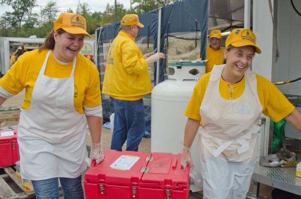 volunteers with Southern Baptist Disaster Relief carry food