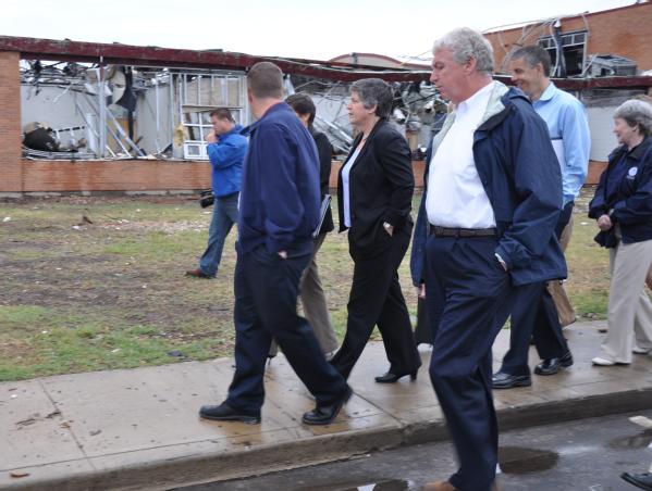  Joplin, Mo., September 22, 2011 -- Homeland Security Secretary Janet Napolitano (middle), FEMA Deputy Administrator Richard Serino (right) and Secretary of Education Arne Duncan tour the damaged high school. Just four months after a tornado destroyed the school, students were able to start the new school year on time in temporary facility.