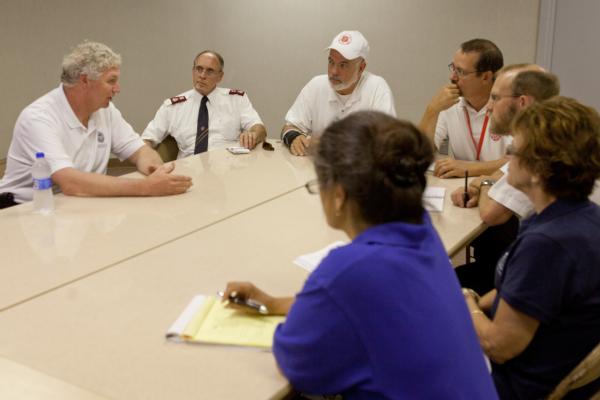 Minot, ND, June 29, 2011 -- Richard Serino (left), Federal Emergency Management Agency (FEMA) deputy administrator, meets with Faith based Volunteer Agencies at the FEMA/State Disaster Recovery Center in South Minot, North Dakota.