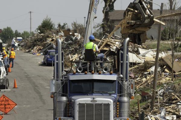 Crews work to remove debris around Joplin, caused by the May 22 tornado.