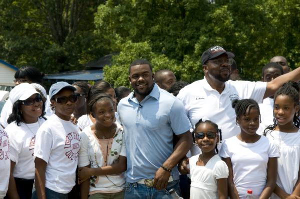  Tuscaloosa, AL, June 11, 2011 -- University of Alabama Heisman Trophy winner and New Orleans Saints running back Mark Ingram poses for pictures with a faith-based volunteer group from Georgia. Mark came back to Tuscaloosa to help FEMA Community Relations by meeting with volunteers and survivors.
