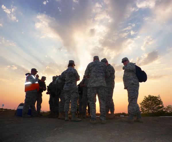 Fort Pierre, SD, June 7, 2011 -- U.S. Air National Guard 114 Fighting Wing members gather at sunrise to begin patrol on the levee in Fort Pierre, S.D. FEMA and other federal agencies are supporting the State Incident Management Team in their effort to prepare for flooding along the Missouri River.