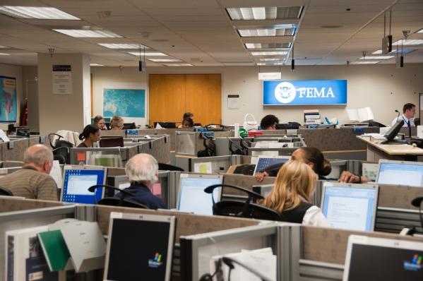 Personnel from FEMA and other federal agencies work side-by-side in FEMA’s National Response Coordination Center.