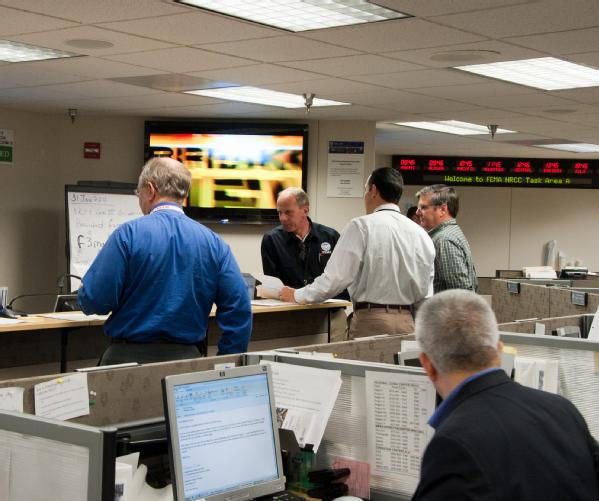 Personnel from FEMA and other federal agencies work side-by-side in FEMA’s National Response Coordination Center.