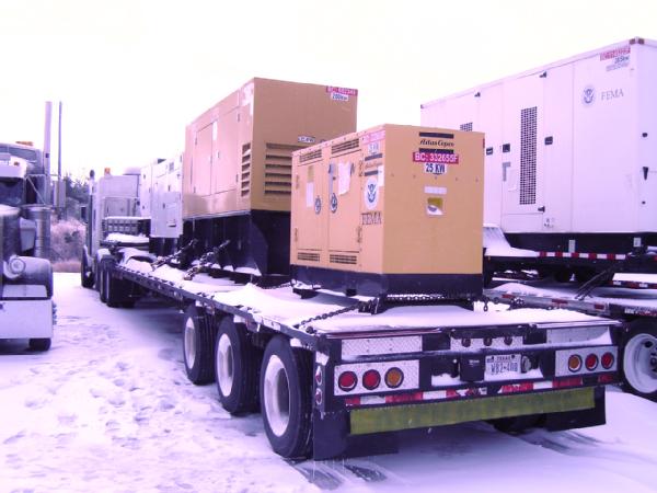 FEMA generators are staged at the Army Ammunition Plant for rapid deployment to support emergency facilities and public buildings.