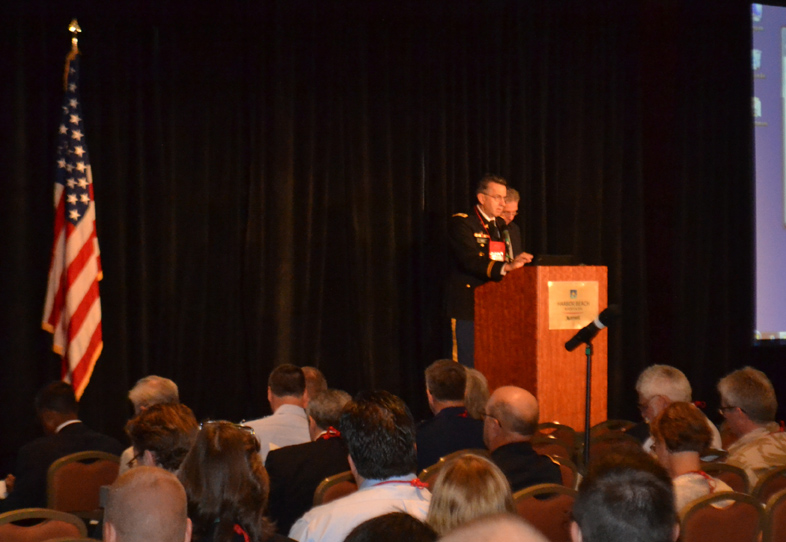 Col. Dallas Hack welcomes attendees to the 2012 Military Health System Research Symposium in Fort Lauderdale, Fla. (Photo: Jeffrey Soares)