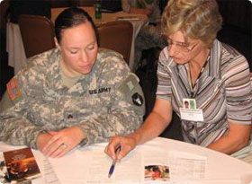 A Transistance Assistance Advisor reviews information with a soon-to-be veteran.