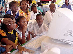 Photo: Children learning about computers at a technology fair in Senegal