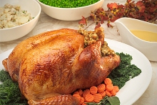 Stuffed roast turkey on platter.