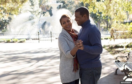 A couple dance in front of the fountain at Forsythe Park in Savannah, Georgia