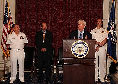 Sen. Christopher Dodd delivers remarks during a commemoration reception to recognize the bicentennial of the War of 1812 as Rear Adm. Robert Burt, left, Chief of Navy Chaplains; Jose Fuentes, Chairman of the Board for Operation Sail; and Vice Chief of Naval Operations Adm. Jonathan Greenert look on. The Navy and Opeartion Sail will continue to commemorate the War of 1812 with events across America through 2015.  U.S. Navy photo by Mass Communication Specialist 2nd Class Kenneth G. Takada (Released)  100414-N-9671T-132