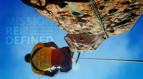 A photo of a Veteran rock climbing