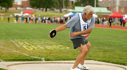 Photo of Veteran throwing a disc