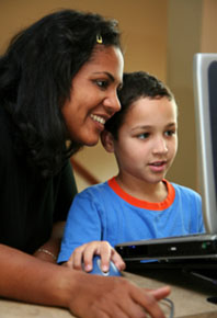 woman and child in front of a computer