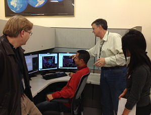 NCO, David Plummer (second from right), discussing AWIPS II Software with members of his team. (From left to right:  Greg Hull, Jun Wu, and Shova Gurung)
