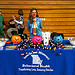 A student from Missouri stands behind the ÒHalloween Safe Zone BoothÓ at a local community center during NDFW.  Participants wore costumes and passed out candy, Shatter the Myths booklets and the Drug IQ Challenge to trick-or-treaters.