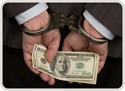 man in handcuffs with money in his hands