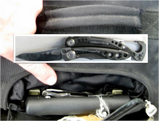 A multi-tool with a knife was detected attached to the handle of the carry-on bag at Denver (DEN).
