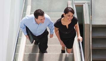 Photo of a man and woman walking up the stairs