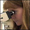 Woman using a microscope