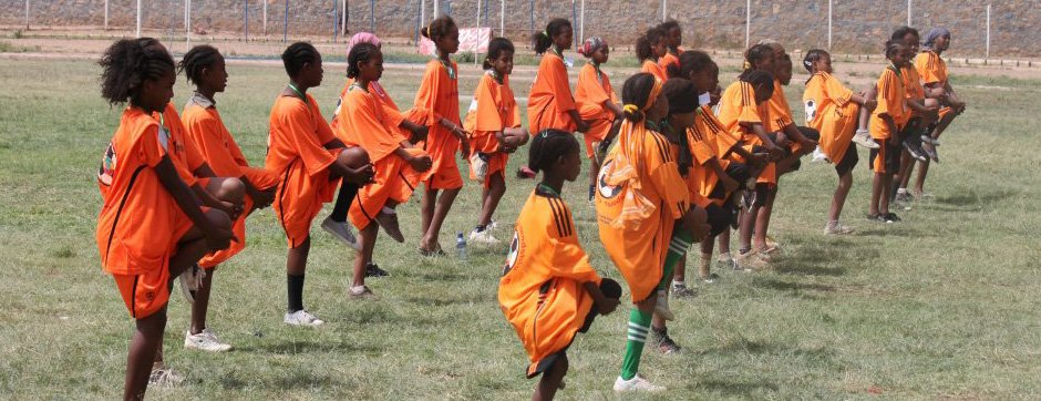 Young Ethiopian girls stretch before their soccer scrimmage in Dire Dawa, Ethiopia. 