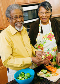 Photo: Senior couple making healthy dinner