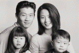 Picture of a father, mother and two children.