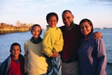 Picture of family in boat on water.