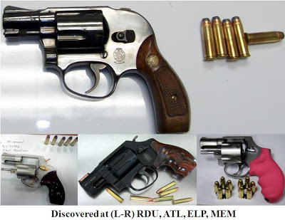 Four loaded revolvers. 