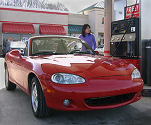 Photo of woman refueling vehicle