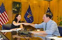 Acting Secretary Harris and Association of Flight Attendants International President Veda Shook conclude a press call on revisions to FMLA concerning flight attendants. Click to view larger image.