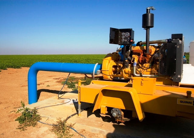 Bright yellow irrigation pump