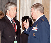 Robert Liscouski (left), the Department of Homeland Security Assistant Secretary for Infrastructure Protection, listens intently to Lieutenant General Harry D. Raduege, Jr., Director of the Defense Information Systems Agency and former NCS Manager