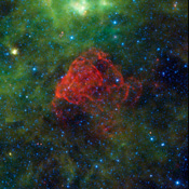 Seen as a red dusty cloud in this image from NASA's Wide-field Infrared Survey Explorer, Puppis A is the remnant of a supernova explosion.