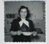 black and white photo of woman holding matzah ball soup, 1954