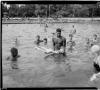 Lifeguard teaching boy to swim,Highland Park swimming pool 1951