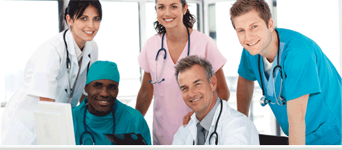 five medical professionals smiling.