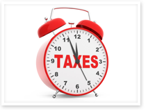 This is an image of an alarm clock with the word taxes.