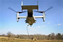 2nd Lt. Edward Lynn, a Marine awaiting training at the Infantry Officers Course, rappels from a MV-22 Osprey during a proof-of-concept training exercise for tactical employment of the aircraft in future operations at Landing Zone Cockatoo on Feb. 6. The average time each Marine to make it down 30 feet was three to five seconds.