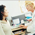 An image of a health professional speaking with a female patient