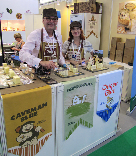 Rogue Creamery representatives display some of their popular cheeses during a 2011 international trade show in Hong Kong. The Oregon company credits the Foreign Agricultural Service’s (FAS) Market Access Program (MAP) and industry partners for helping the company expand international sales of its award-winning cheeses. (Courtesy Photo)