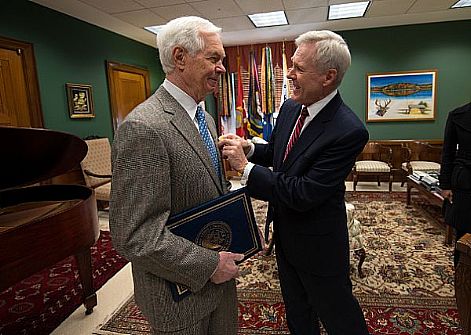 Secretary of the Navy (SECNAV) the Honorable Ray Mabus presents the Department of the Navy's highest award for civilians, the Navy Distinguished Public Service Medal, to U.S. Senator Thad Cochran at the Hart Senate Office Building. Mabus presented Cochran with the award for his exemplary service and support of the Navy and Marine Corps while in the Senate.  U.S. Navy photo by Chief Mass Communication Specialist Sam Shavers (Released)  130124-N-AC887-005