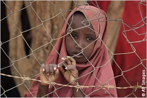 A Somali girl waits to receive food rations in a camp in Kenya. Small children are among those most severely affected by this crisis.