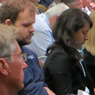 People listening to a public hearing