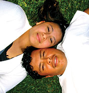 Image of teenagers laying down on the lawn