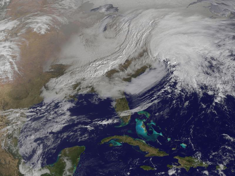 Image description: The satellite image, captured today at 9:01 a.m. EST, shows clouds associated with the western frontal system stretching from Canada through the Ohio and Tennessee valleys, into the Gulf of Mexico.
The comma-shaped low pressure system located over the Atlantic, east of Virginia, is forecast to merge with the front and create a powerful nor&#8217;easter. The National Weather Service expects the merged storm to move northeast and drop between two to three feet of snow in parts of New England.
Photo from NASA.
Stay safe in severe winter weather with these tips from Ready.gov.