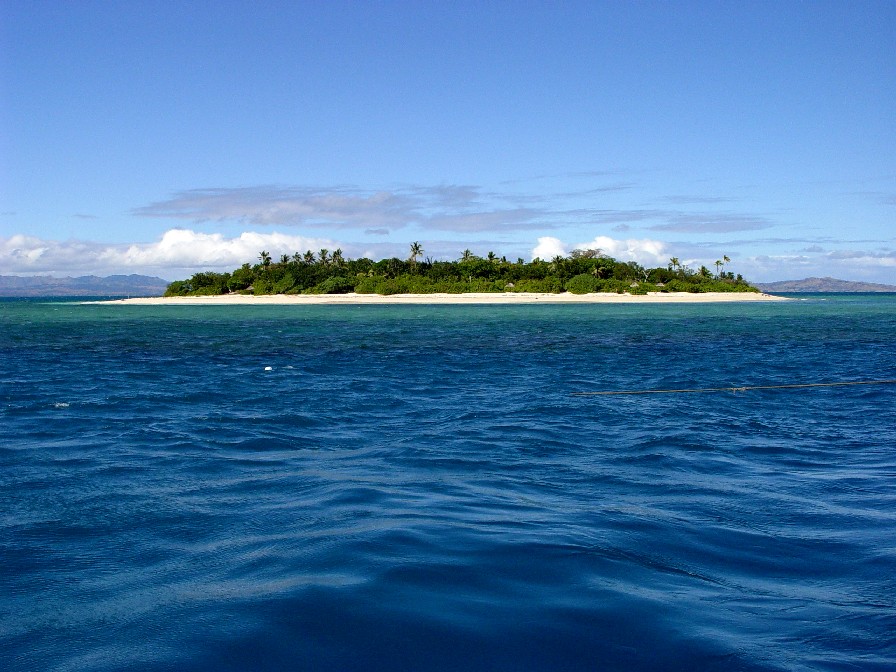 Image of an island on the sea with blue sky