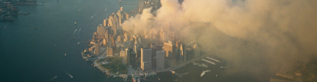 aerial shot of the twin towers burning